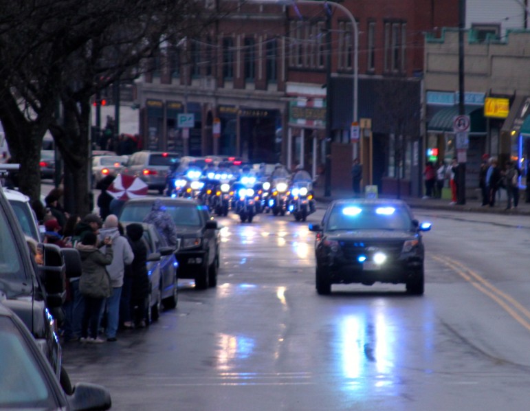 The beginning of the procession through Watertown for town-native Edward Walsh, the Boston firefighter who died on Wednesday.