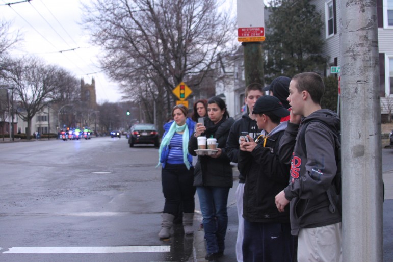 Some of the many people who lined Mt. Auburn Street to pay respects to Lt. Edward Walsh. 