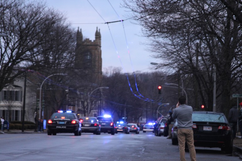 The procession for fallen Boston Fire Lt. Edward Walsh leaves Watertown Square, heading to Stanton Funeral Home in East Watertown.