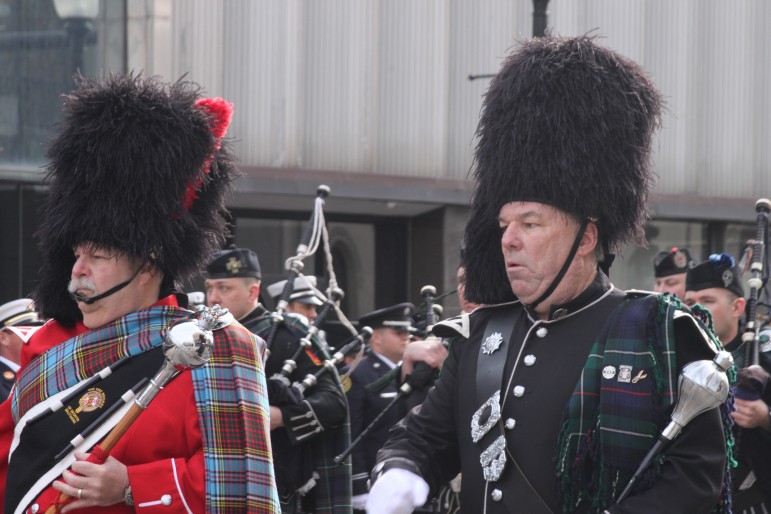 Hundreds of firefighter bagpipers and drummers led the procession through Watertown Square for Lt. Edward Walsh's funeral.