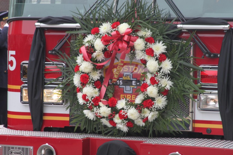 A wreath hangs on the front of Boston Ladder 15, housed in the station where Edward Walsh worked.