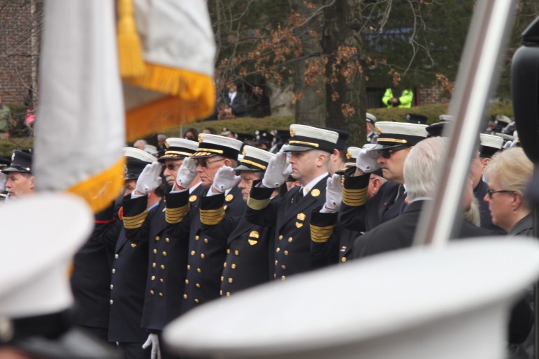 Firefighters salute Lt. Edward Walsh in a final farewell at his funeral.