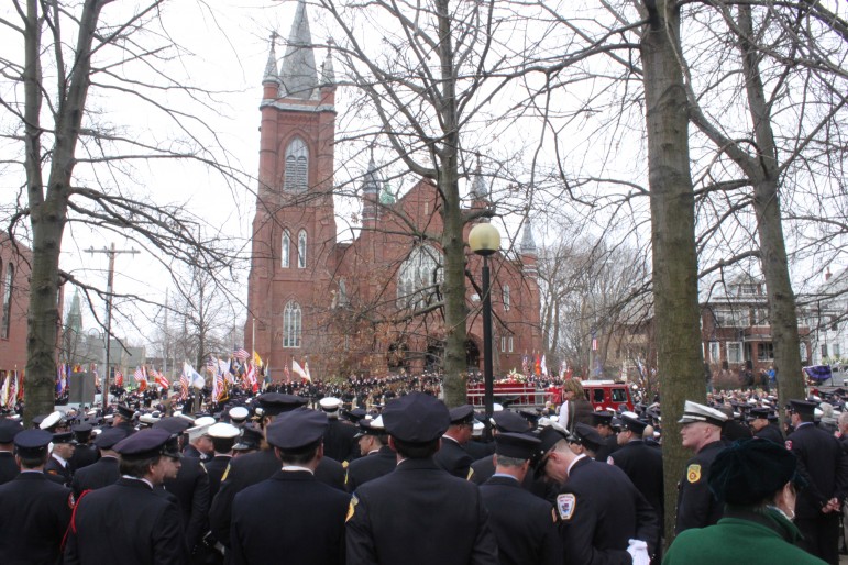 Some of the thousands of firefighters who paid respects to Lt. Michael Walsh outside St. Patrick's Church in Watertown.