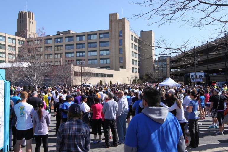 People packed the Tufts Health Plan parking lot off of Arlington Street for the Finish Strong Road Race.