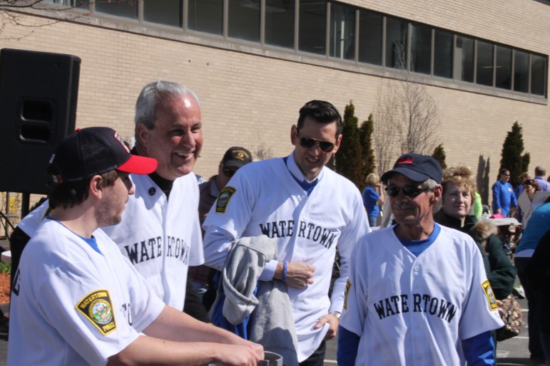 Dave Henneberry (right) the man who found the second bombing suspect in his boat, attended the race along with  Watertown Police Chief Ed Deveau, second from left, and Jeff Bauman (far right) a man who lost both legs in the Marathon Bombing.