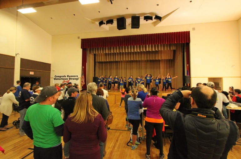 Parents watch students from the Maria's School of Dance perform after the Finish Strong Road Race.