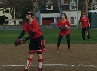 Destiny Santalucia, Stella Papadopoulou, and Amelia Doyle defending for Watertown against Waltham.