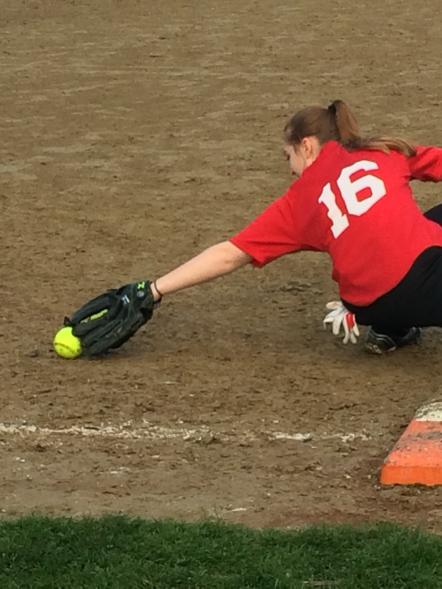 Jacquie Furbish stretches for the out in Watertown's victory over Waltham.
