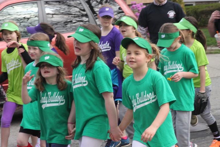 Watertown Softball players paraded to opening day at Casey Park on Watertown Street Saturday morning.