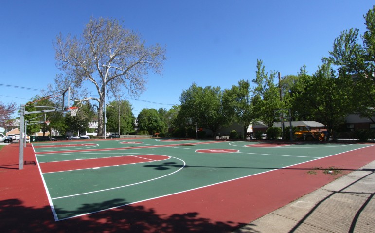 The newly resurfaced basketball courts at Casey Park, including new lights.