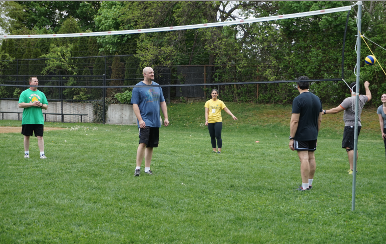 Tufts Health Plan employees enjoy a game of volleyball during the company's annual Field Day.