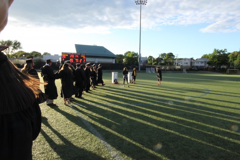 Graduates line up for their graduation photo at the Watertown High School Class of 2014 graduation.