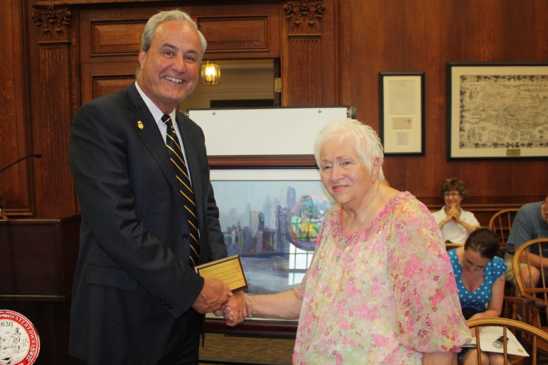 Former Watertown resident Dorothy Noke presented Police Chief Edward Deveau with a painting and plaque in honor of the WPD's actions during the events of April 19, 2013.