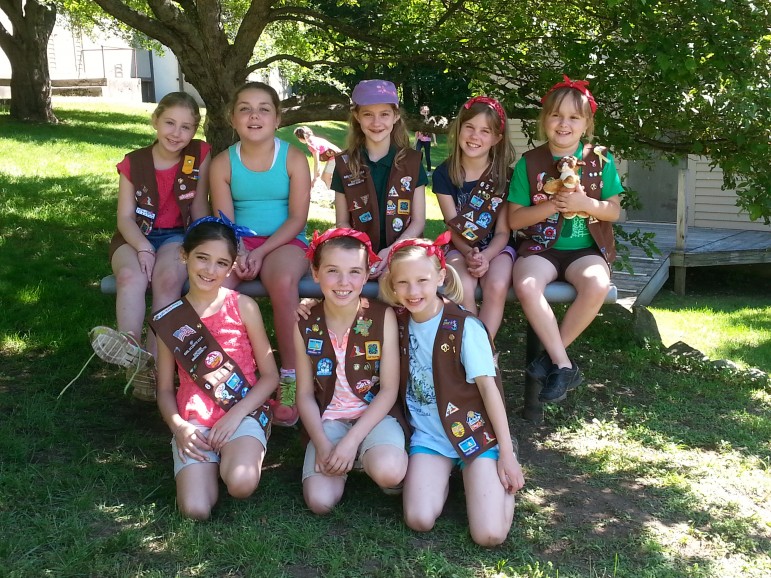 Girls from Troop 65201 take a well deserved break during their trip to Camp Cedar Hill in Waltham.