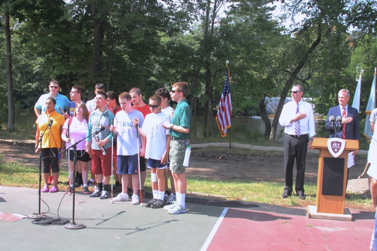 A chorus from the Perkins School for the Blind opened the ground breaking ceremony. These and other students will be able to use the new Sensory Garden and Braille Trail when construction is complete.