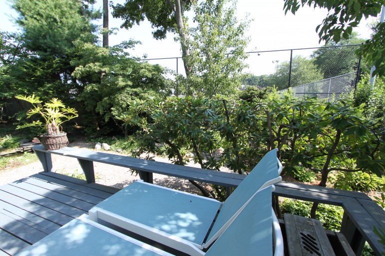 Tennis courts at Victory Field sit just outside the back yard of Marion Road residents Elodia Thomas and Bruce Coltin.