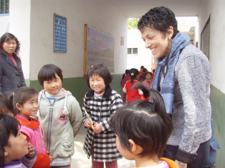 An educator speaks with children during a Primary Source Study Tour of China.