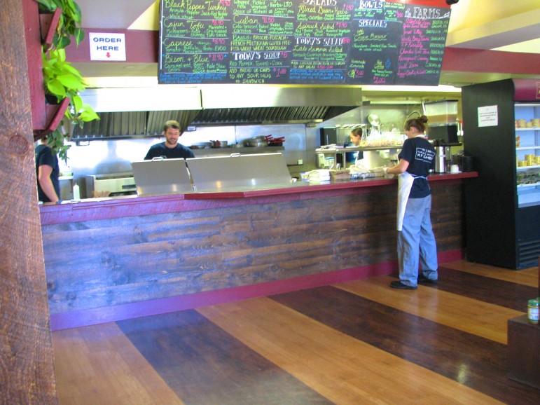 The chalkboard at Farmer's Market Kitchen displays the menu featuring locally produced food.