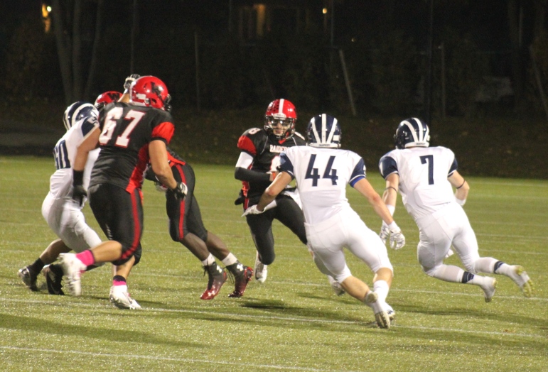 Watertown quarterback Nick Giordano runs the ball against Swampscott.