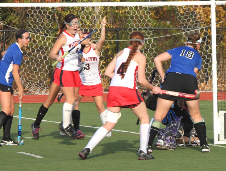 Watertown co-captain Emily Loprete jumps in celebration after scoring the Raiders' second goal in the state semifinal win over Dover-Sherborn.