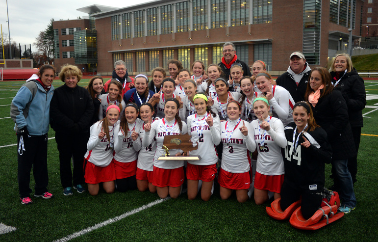 The Watertown field hockey team pose for a photo with the 2014 MIAA Div. 2 State Championship trophy - the school's sixth straight.