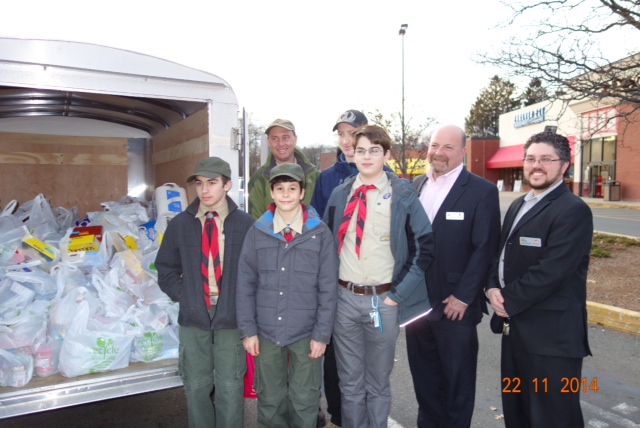 Boy Scouts outside of Stop & Shop, Watertown St. - Nicholas Cordiero, Levi Mattison, Gavin Like, Miles Hohmann, Stop & Shop Store Manager Richard Nolan, Stop & Shop Assistant Store Manager Devin Haywood; back row: Scoutmaster Christopher DeRocher and Gavin Like.