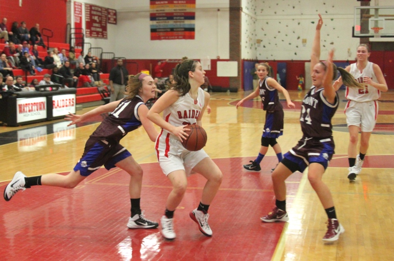 Watertown junior forward Felicia Korte goes up for a shot against Belmont.