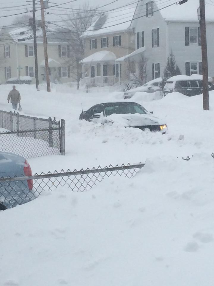 Snow covers a car on Fayette Street during the Blizzard of 2015.