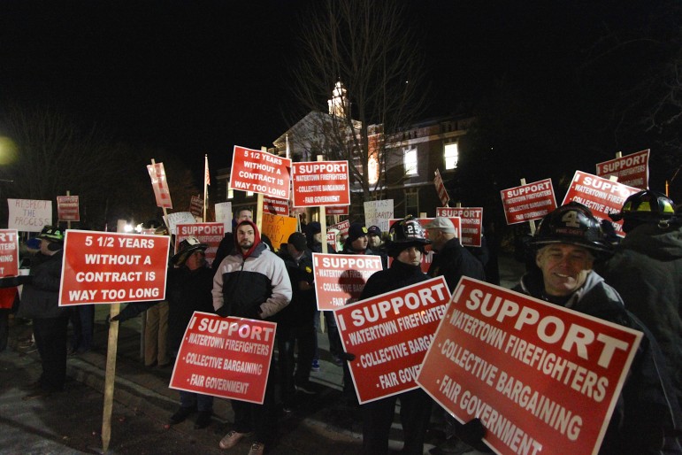 Nearly 400 people rallied in front of Town Hall in support of the Watertown Firefighters.