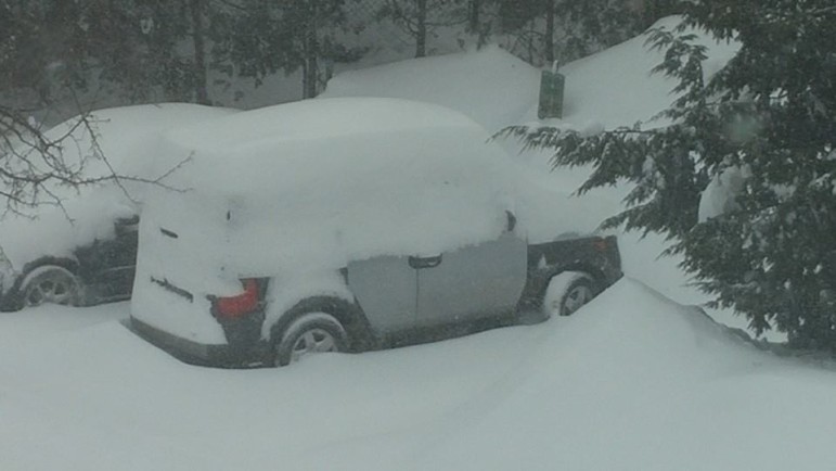 Several inches of snow have piled up on this car in Watertown.