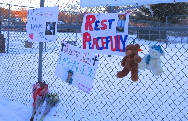 Tributes to Adonis, a Watertown High School sophomore left by classmates next to the courts where he played basketball.