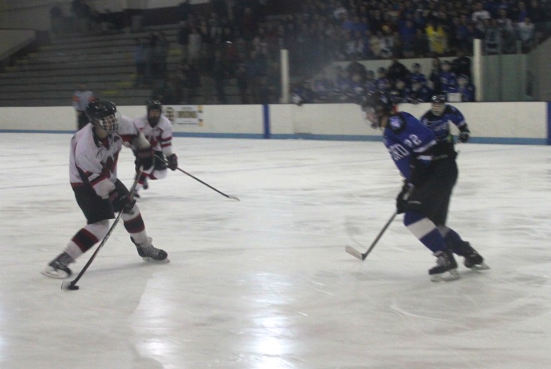 A Raider shoots on the Bedford goal during Friday's North Section final at the Chelmsford Forum.