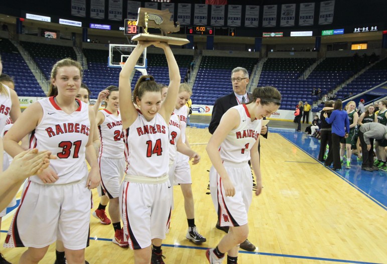 Senior Gianna Coppola holds up the Div. 2 North Section girls basketball trophy after Watertown beat Pentucket 44-40.