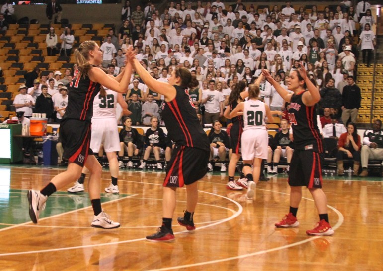 Watertown center Shannon Murphy, left, gets a high-five from guard Michaela Antonellis after Murphy scored to end the first quarter.