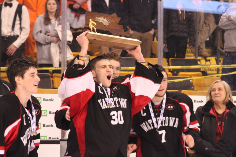 Watertown captain and senior goalie Anthony Busconi celebrates winning the MIAA Div. 3 boys hockey state championship Sunday at the TD Garden. 