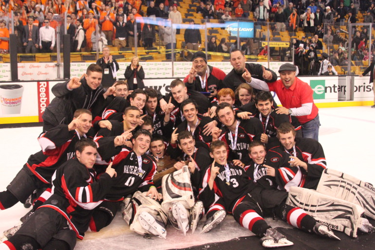 The State Champion Watertown Raiders boys' hockey team poses with the MIAA Div. 3 championship trophy after beating Agawam 2-1.