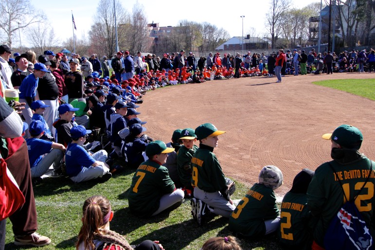 Watertown's Little League baseball and softball teams line the diamond at Casey Park on opening Day.