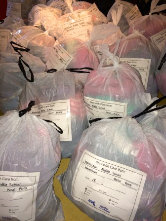 Watertown Middle School collected dozens of bags of kids clothes for Cradles to Crayons.