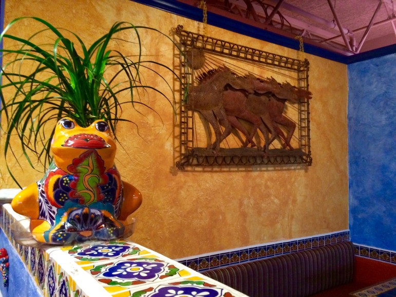 The interior of Ixtapa Mexican Grill & Cantina features tiles and ceramics from Mexico. This shows the interior of the Acton location.