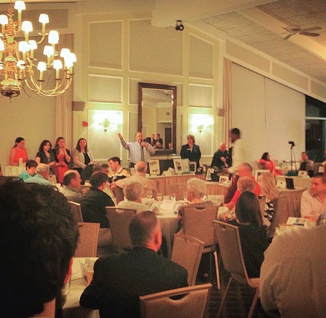 Board Member and Auctioneer John Madden entices the crowd at the Watertown Boys and Girls Club’s Annual Spring Auction.