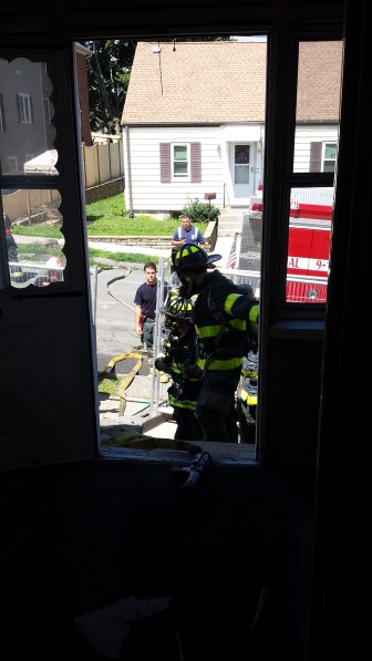 Watertown Firefighters prepare to enter a home for during a training exercise. The developer allowed the home to be used before it is demolished.