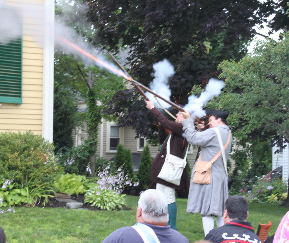 Colonial reenactors fire muskets to celebrate the reading of the Declaration of Independence, which was first done in Massachusetts in Watertown on July 18, 1776.