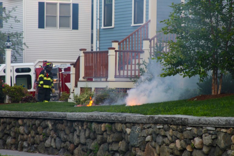 A fire started on the lawn of a Spring Street home when a power line broke and fell Thursday morning.