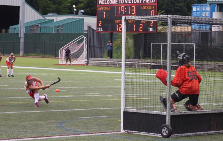 Watertown's Kourtney Kennedy scores her second goal against Winchester on a penalty stroke.