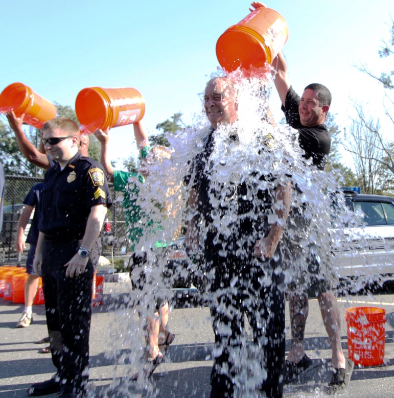 Interim Waterotwn Police Chief gets an icy shower as part of the ALS Ice Bucket Challenge.