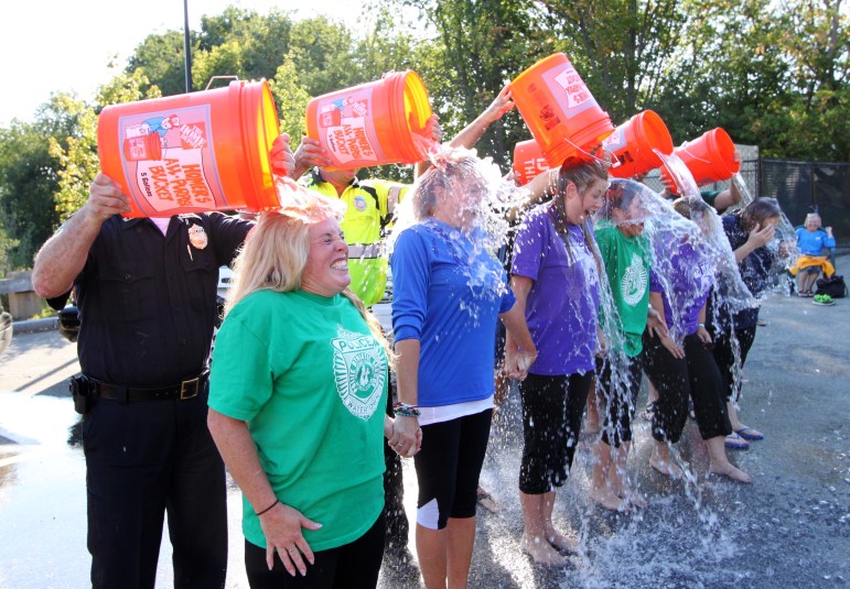 The female members of the Watertown Police Department, including School Resource Officer Kerry Kelley, left, stepped up to the ALS Ice Bucket Challenge.