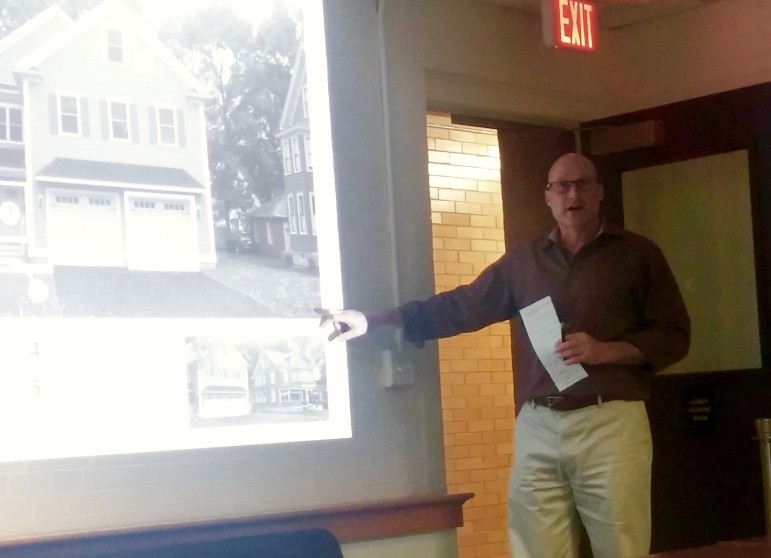 Consultant David Gamble shows residents examples of bad design during the Community Listening Session at Town Hall. 