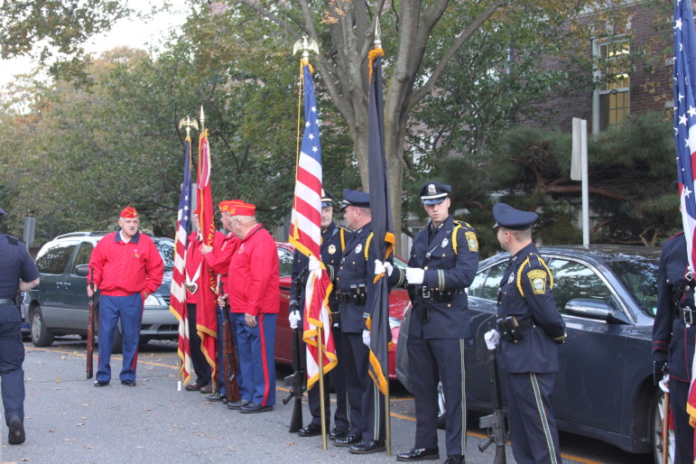 The color guards from the Marine Corps League Shutt Detachment, Watertown Police Department, and Watertown Fire Department prepare for the Purple Heart ceremony. 