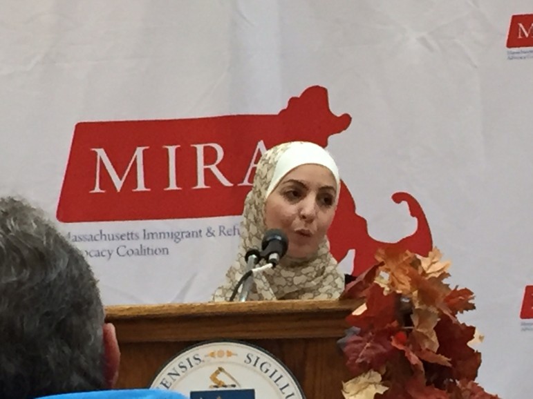 Watertown resident Amira Elamri speaks at State House Luncheon to celebrate immigrants.