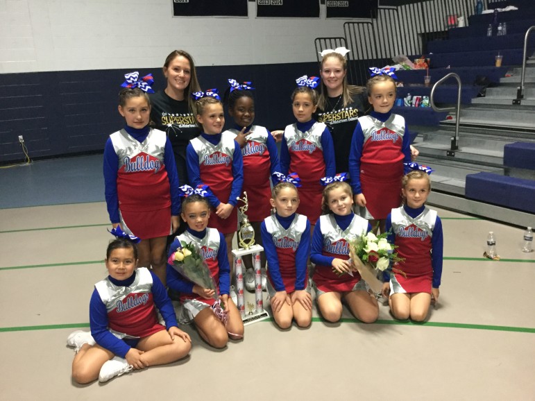 The Watertown-Belmont Youth Cheerleaders got a trophy at the competition in Medford